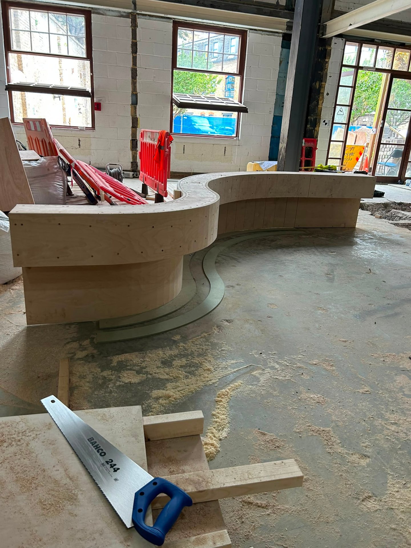 Curved plywood formwork set out for a reinforced concrete slab with toe detail